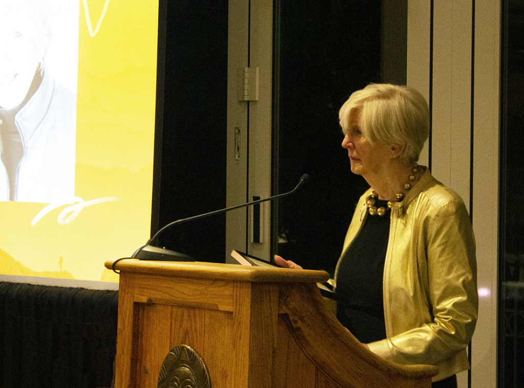 Bev Trout accepts award